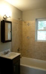 Bath tile accent above our recycled tubs are a Tony Thompson signature feature
